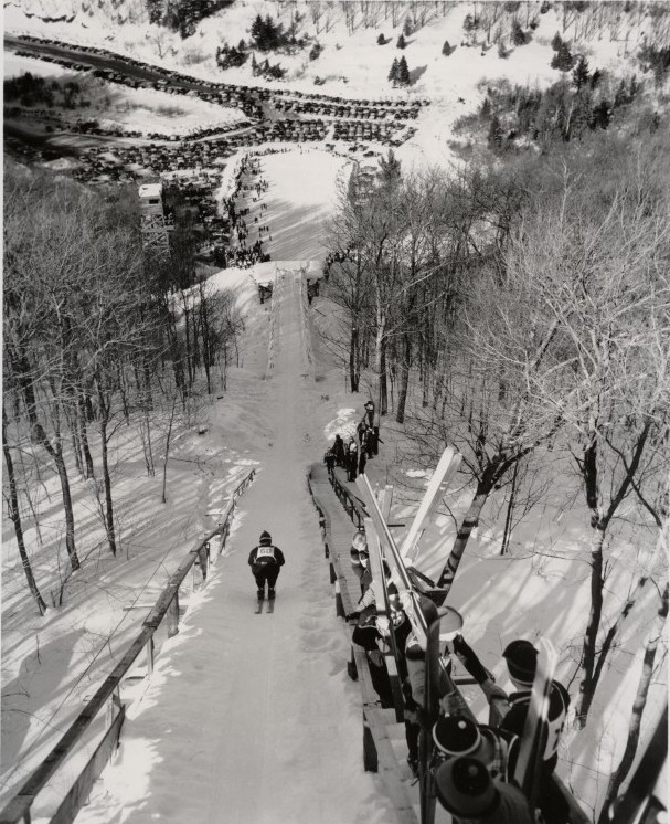 A skier glides down Suicide Hill, circa 1959, photo by Michigan Tourist Council
