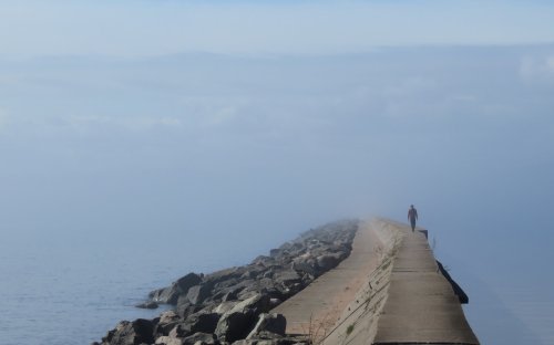 Walking the breakwater in the fog