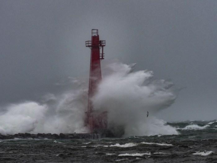 Muskegon South Pier leaning into the gale by Jerry Herrendeen